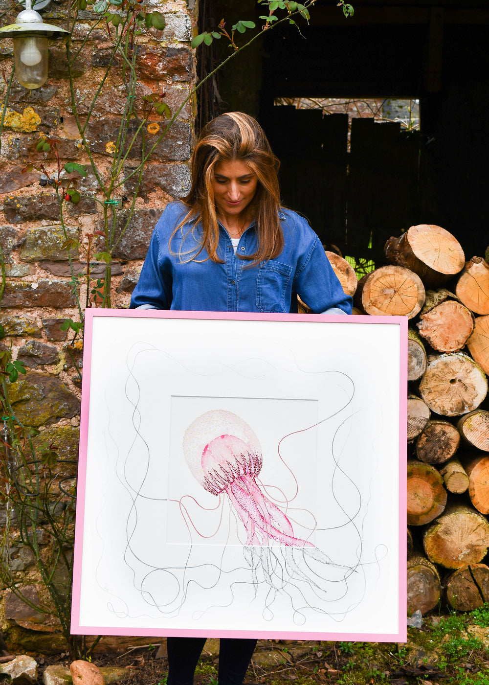 samantha frances holding a jellyfish art work
