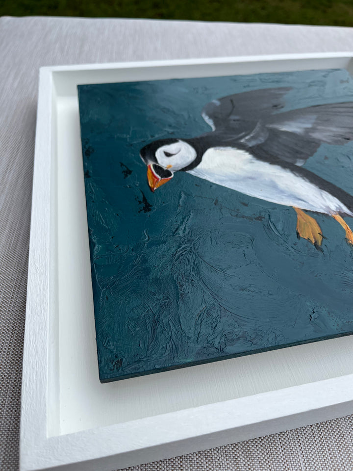 angled image from the left, to see the painting framed in a white floating frame