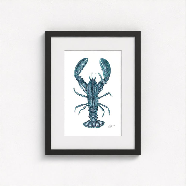 lobster print on wall in black frame  on white wall