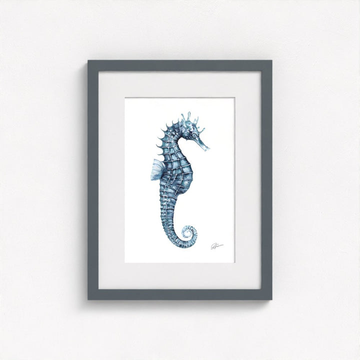 seahorse print on wall in grey frame  on white wall