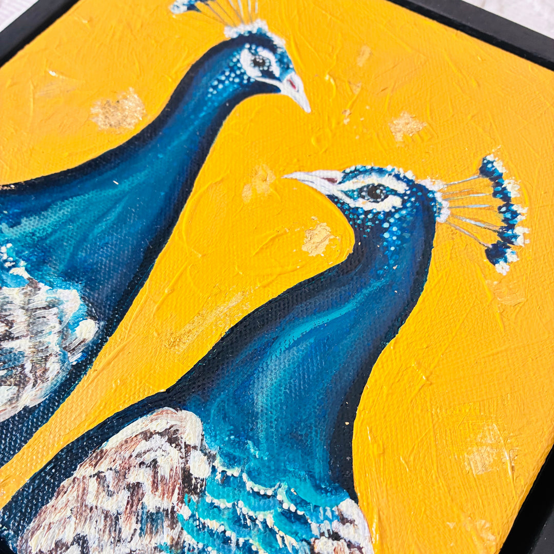 Painting of two peacocks on a yellow background
