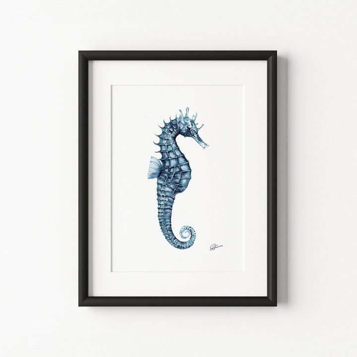Framed artwork of a blue seahorse on a white background
