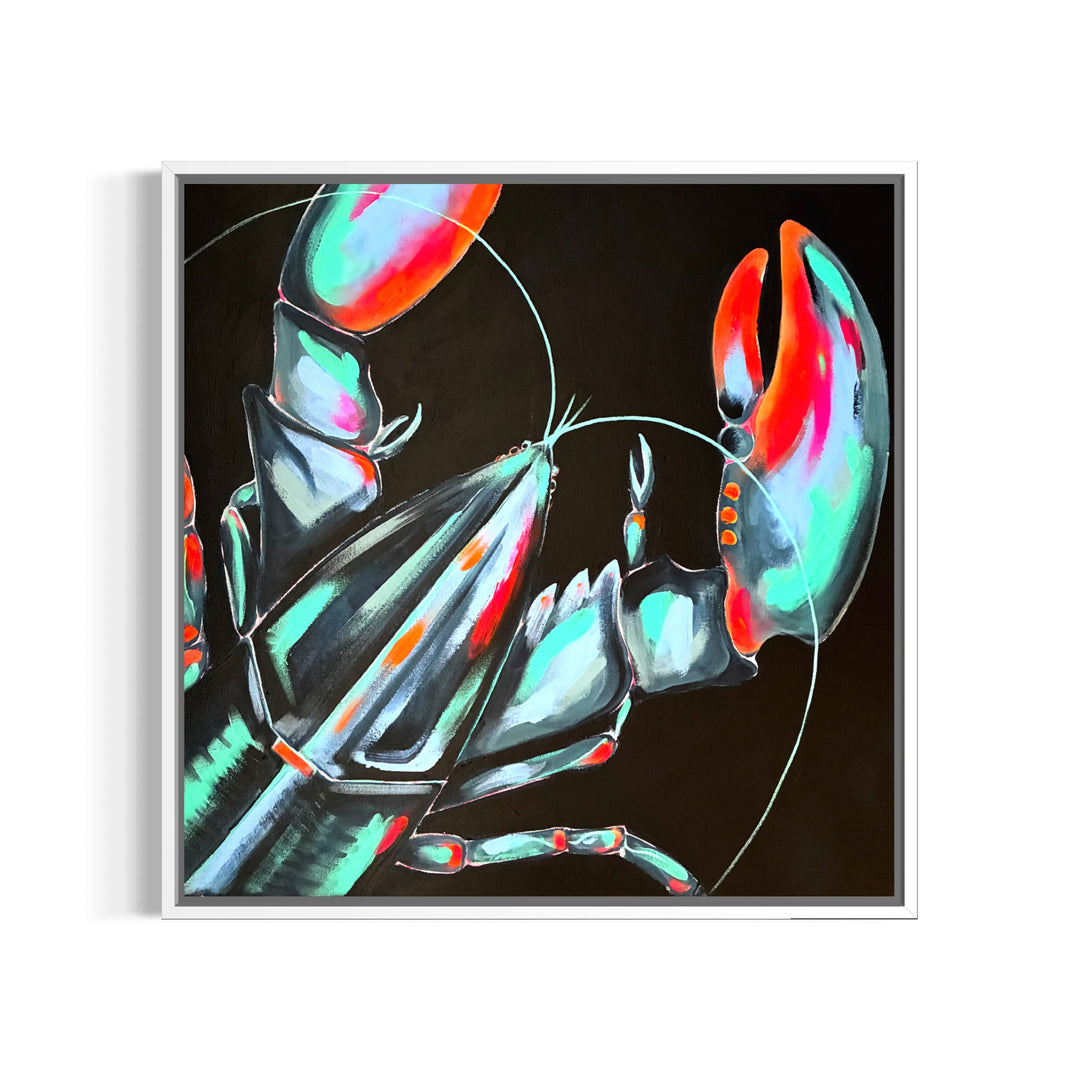 A framed square art print featuring a stylized lobster or crab with metallic teal, aqua, and red tones on a black background, shown against a white wall.