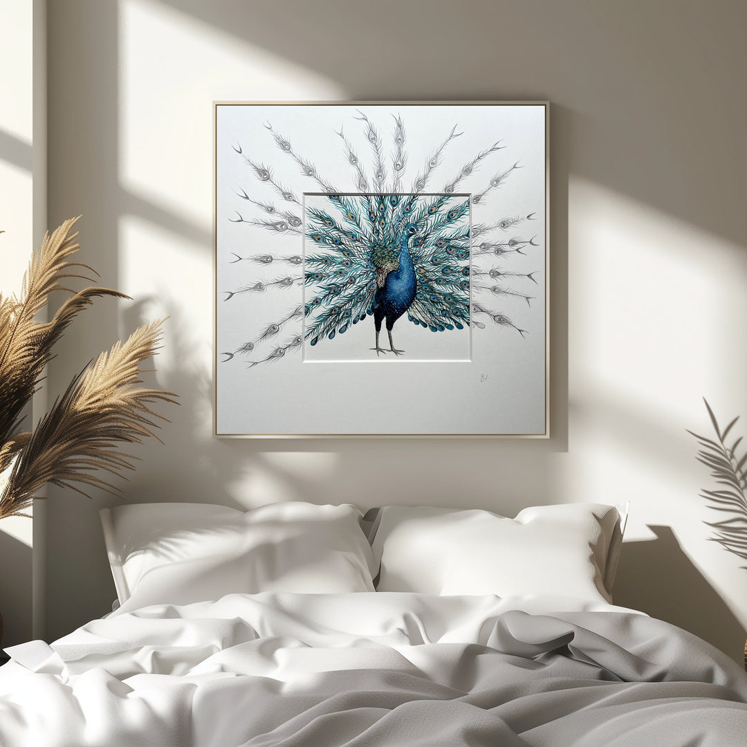 Framed artwork of a peacock on a wall above a bed with natural light filtering through.