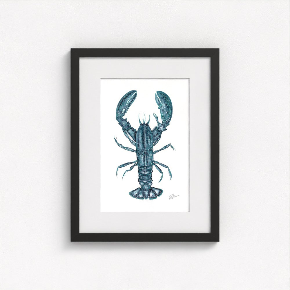 lobster print on wall in black frame  on white wall
