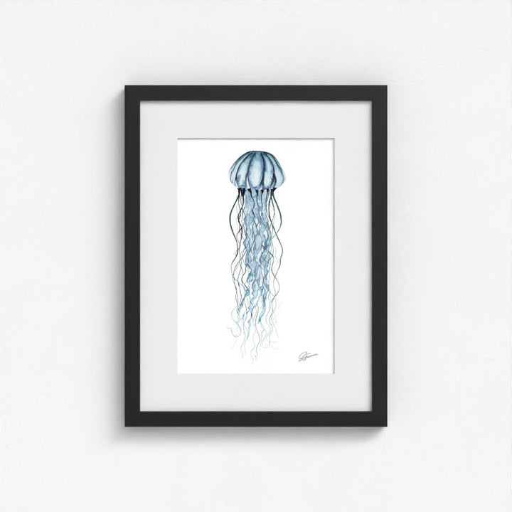 jellyfish print on wall in black frame  on white wall