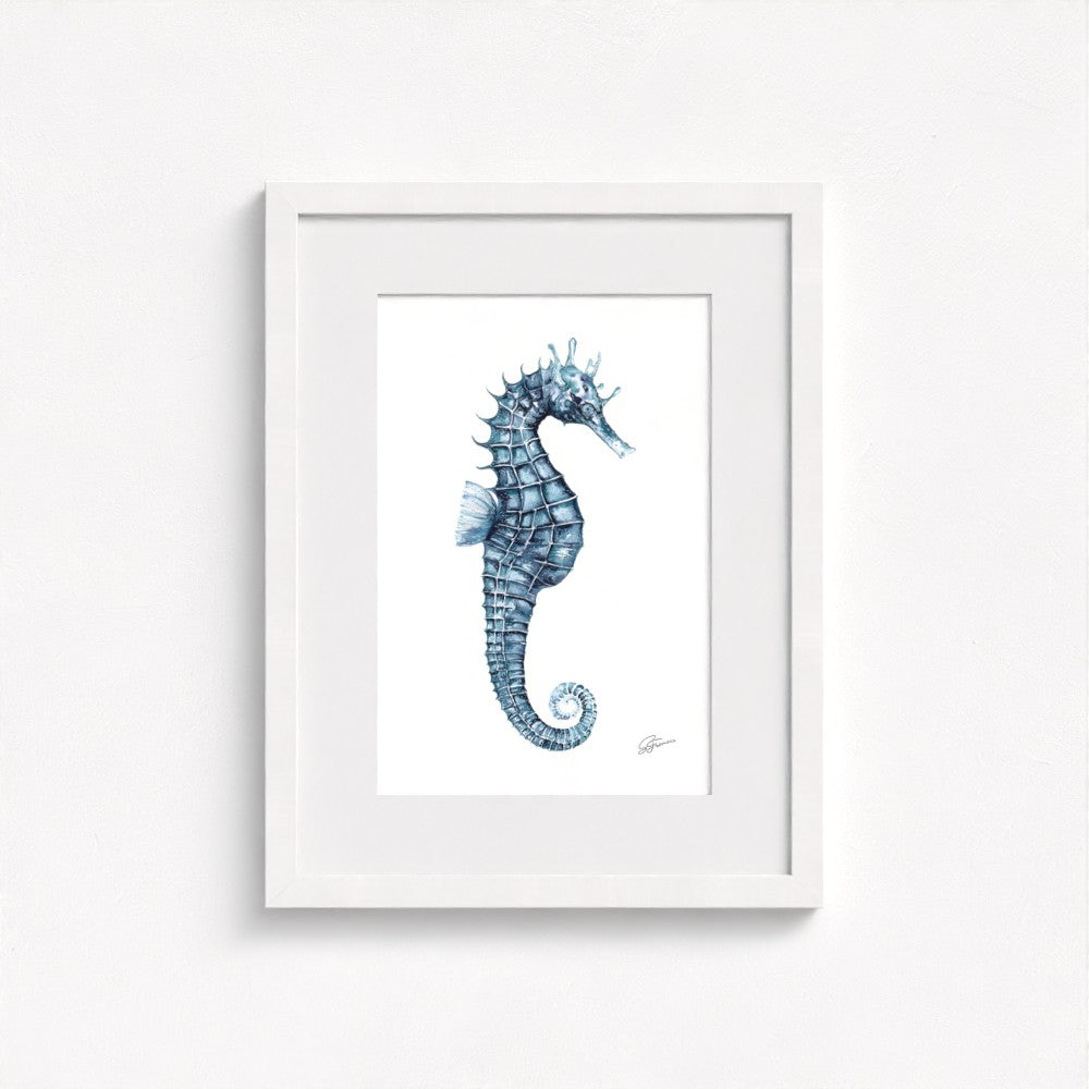 seahorse print on wall in white frame  on white wall