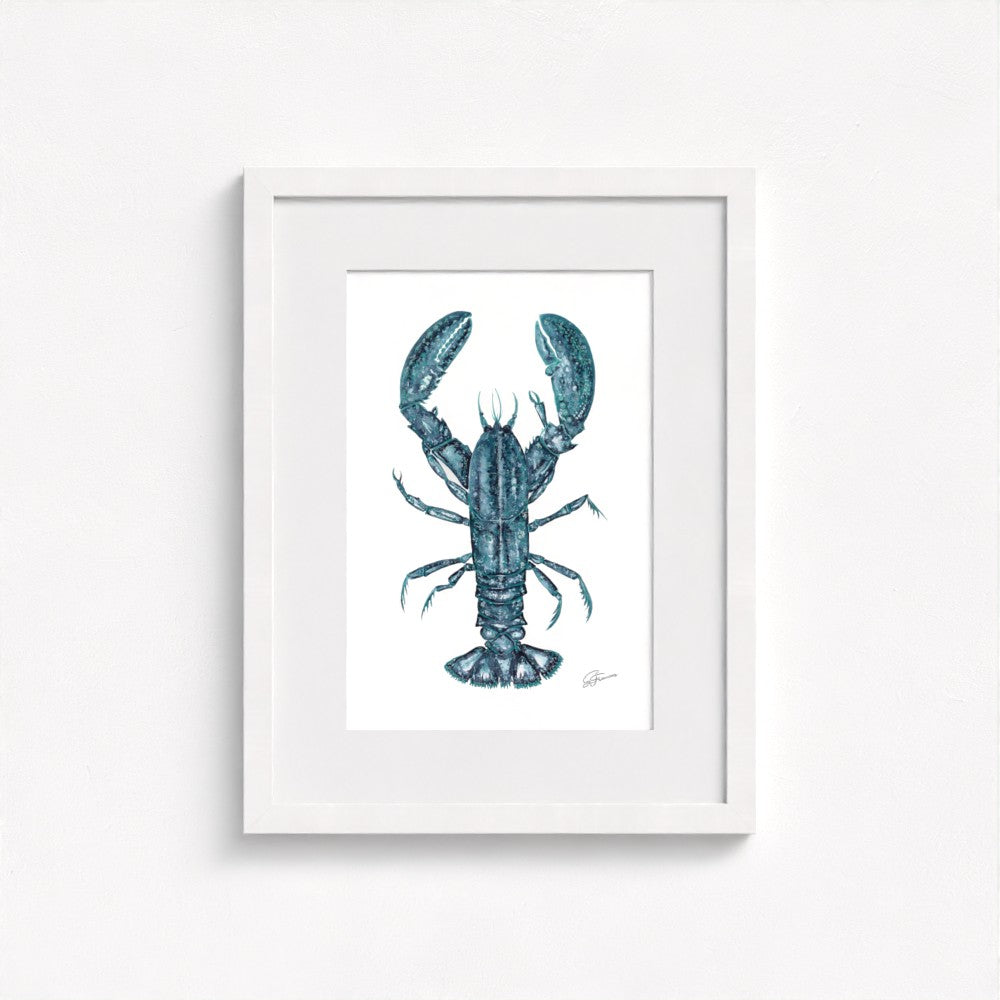 lobster print on wall in white frame  on white wall