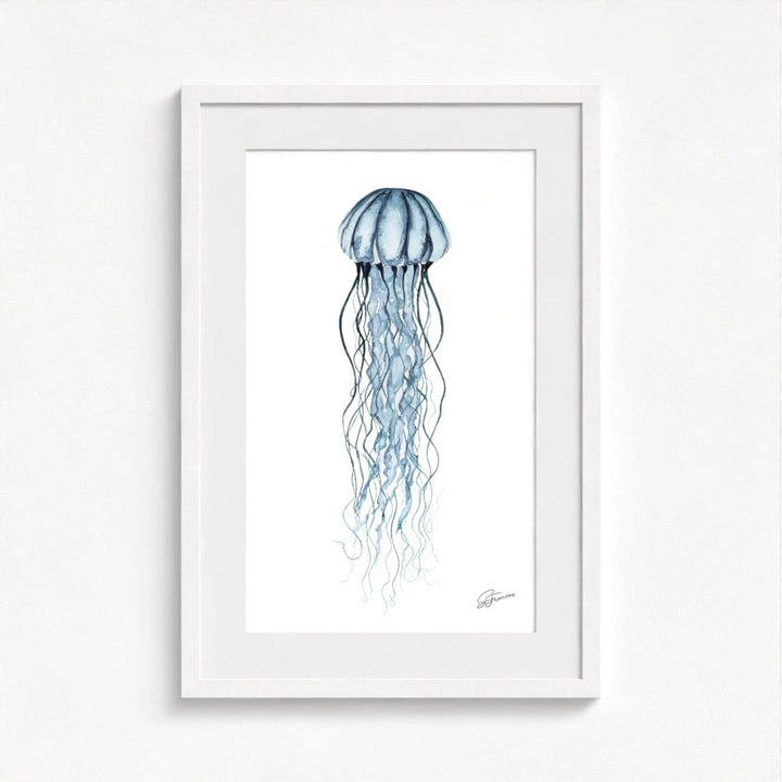 jellyfish print on wall in a white frame  on white wall