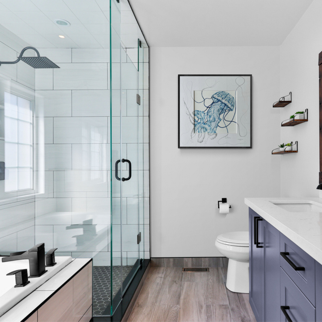 blue jellyfish painting with a sketched mount in a bathroom with a shower to the left and sink to the right